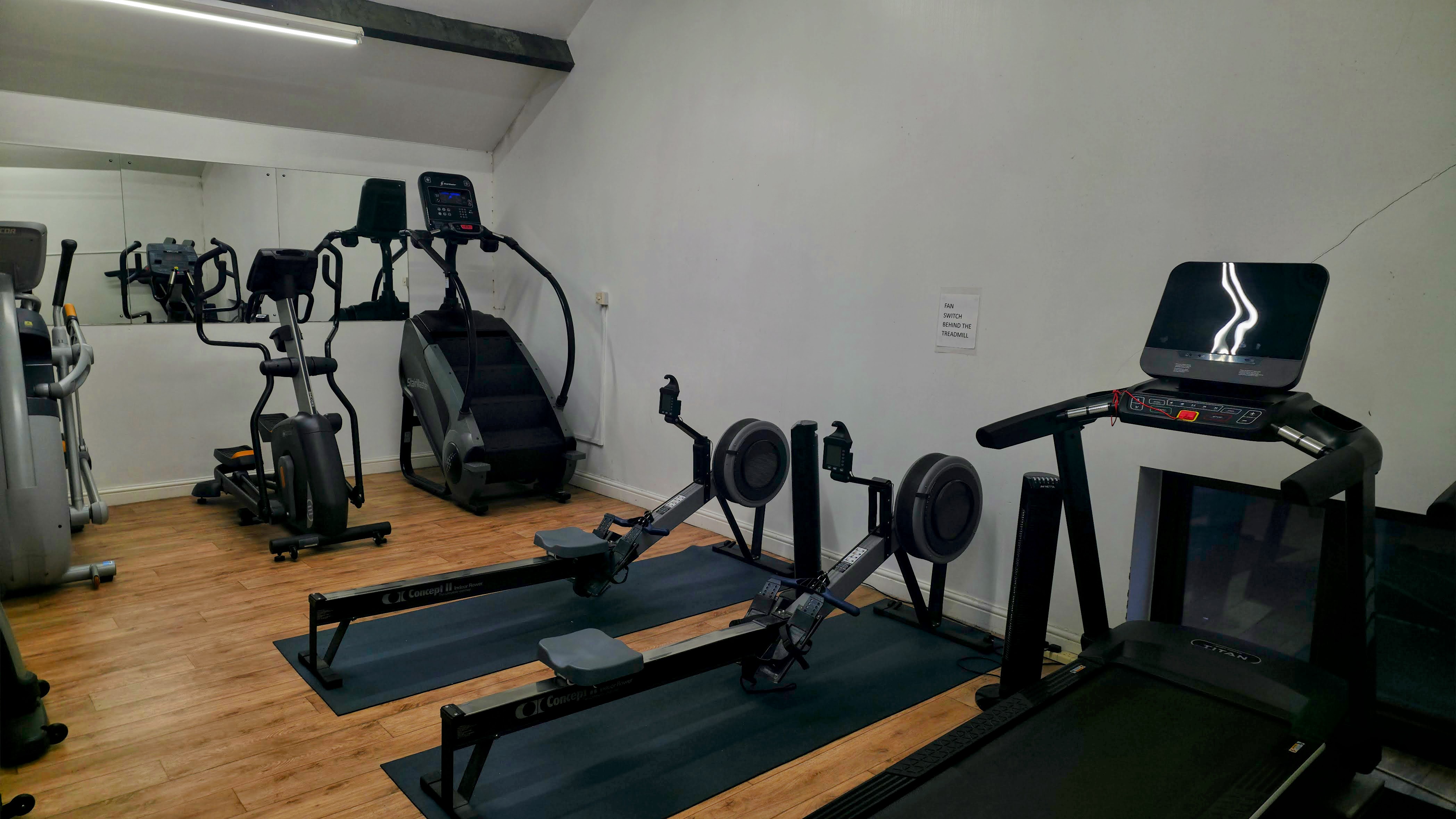 Cardio room with bikes, cross trainers, and rowing machines