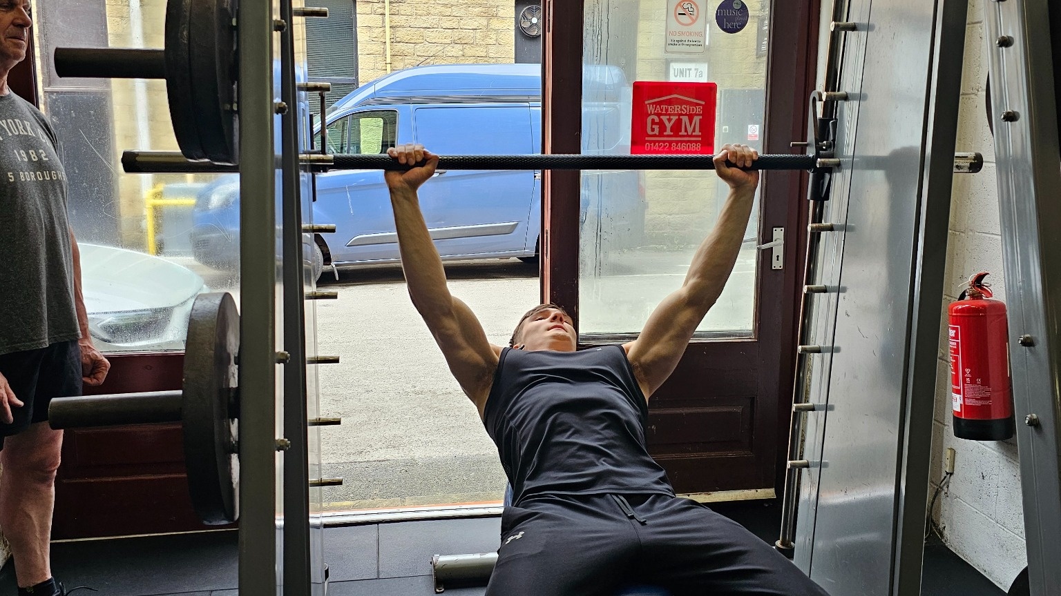 Plate-loaded Smith machine and weight storage